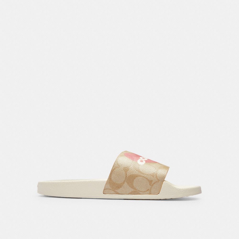COACH®,ULI SPORT SLIDE IN SIGNATURE CANVAS WITH HEART,Light Khaki/Pink,Angle View