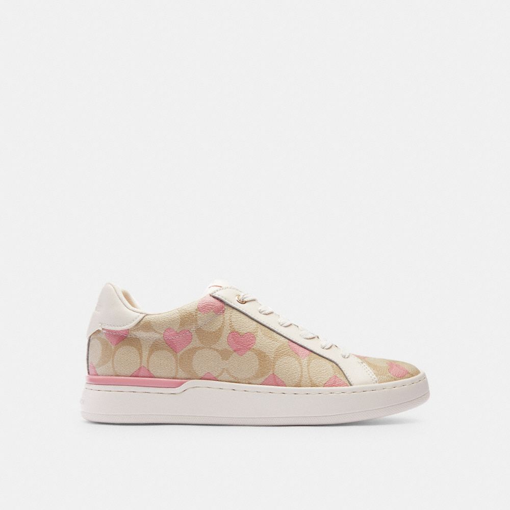 COACH®,CLIP LOW TOP SNEAKER IN SIGNATURE CANVAS WITH HEARTS,Light Khaki/Pink,Angle View