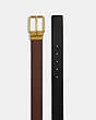 COACH®,SQUARE ROLLER BUCKLE CUT-TO-SIZE REVERSIBLE BELT, 38MM,Pebbled Leather,Antique Brass/Dark Saddle Black,Angle View
