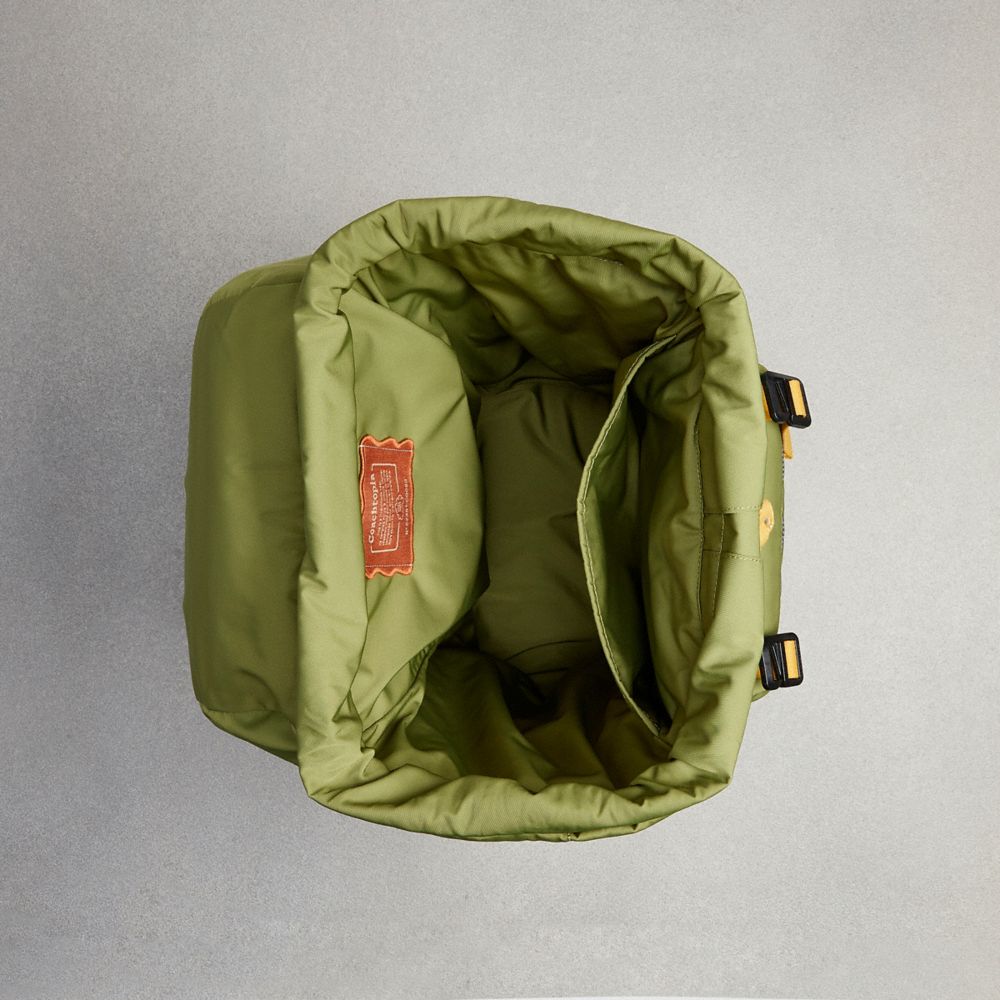 Coach olive green online backpack