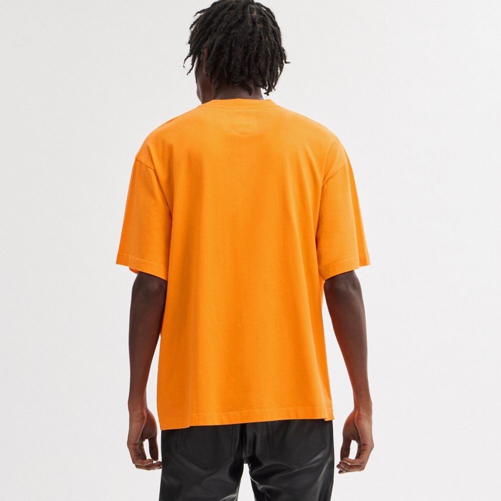 COACH®,The Lil Nas X Drop Sun T Shirt,Cotton,T Shirt,Word Embellishment,Graphic,Casual,Orange,Scale View