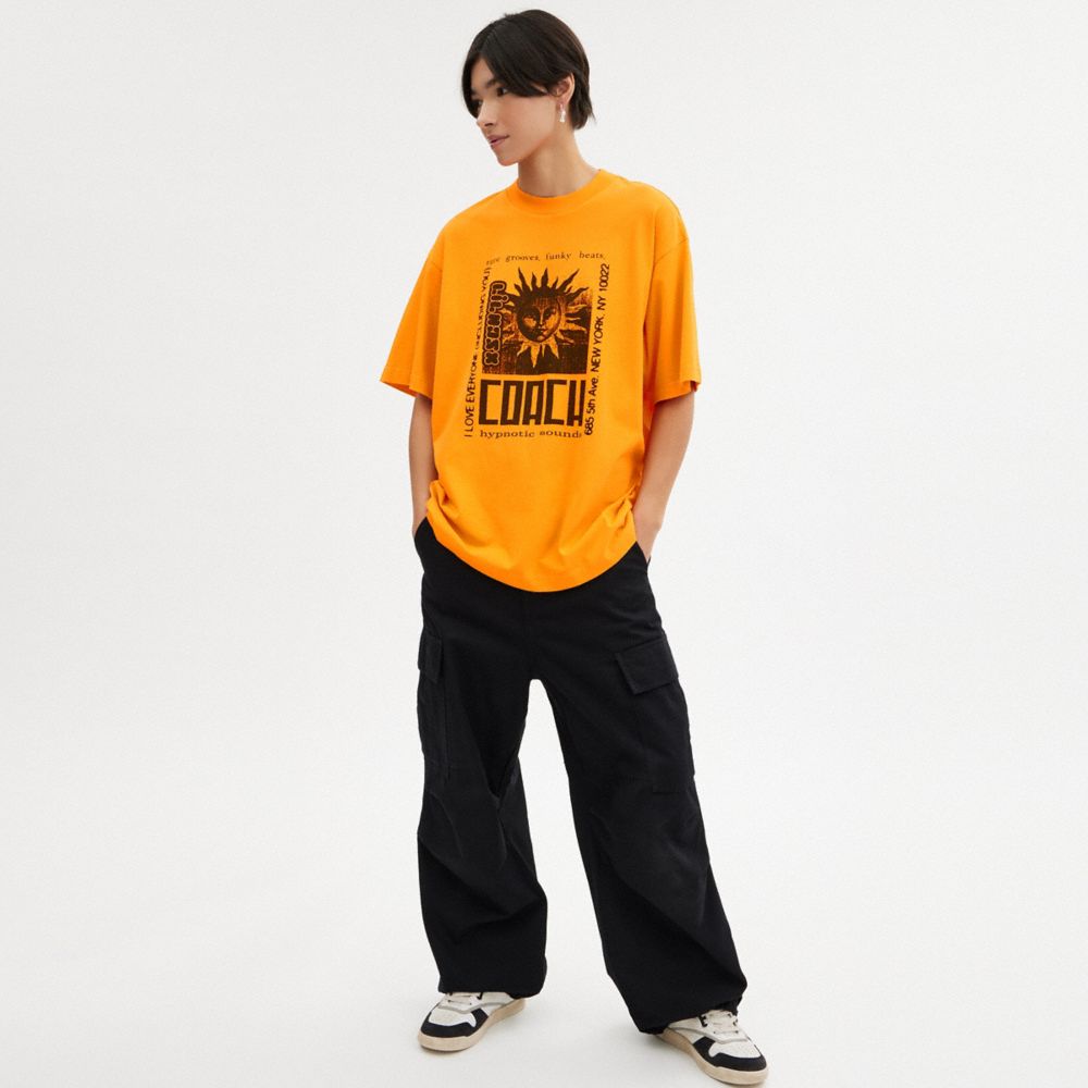 COACH®,The Lil Nas X Drop Sun T Shirt,Cotton,T Shirt,Word Embellishment,Graphic,Casual,Orange,Scale View