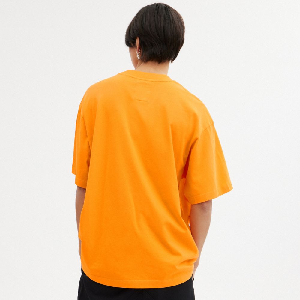 COACH®,The Lil Nas X Drop Sun T Shirt,Cotton,T Shirt,Word Embellishment,Graphic,Casual,Orange,Scale View