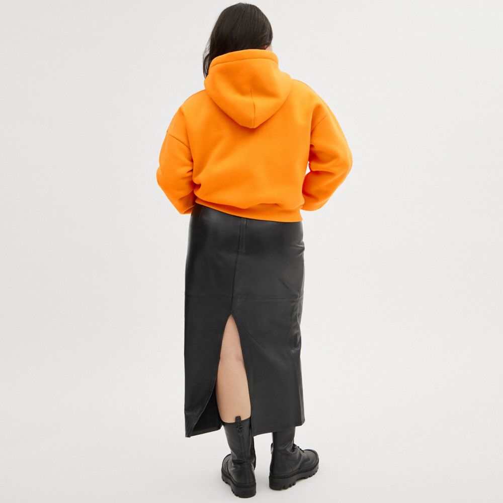 COACH®,The Lil Nas X Drop Cropped Pullover Hoodie,Polyester,Elastane,Cotton,Knit,Sweatshirt,Word Embellishment,Drawstring,...,Orange,Scale View