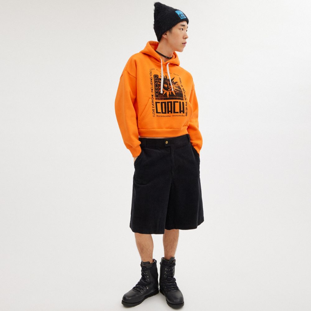 COACH®,The Lil Nas X Drop Cropped Pullover Hoodie,Polyester,Elastane,Cotton,Knit,Sweatshirt,Word Embellishment,Drawstring,...,Orange,Scale View