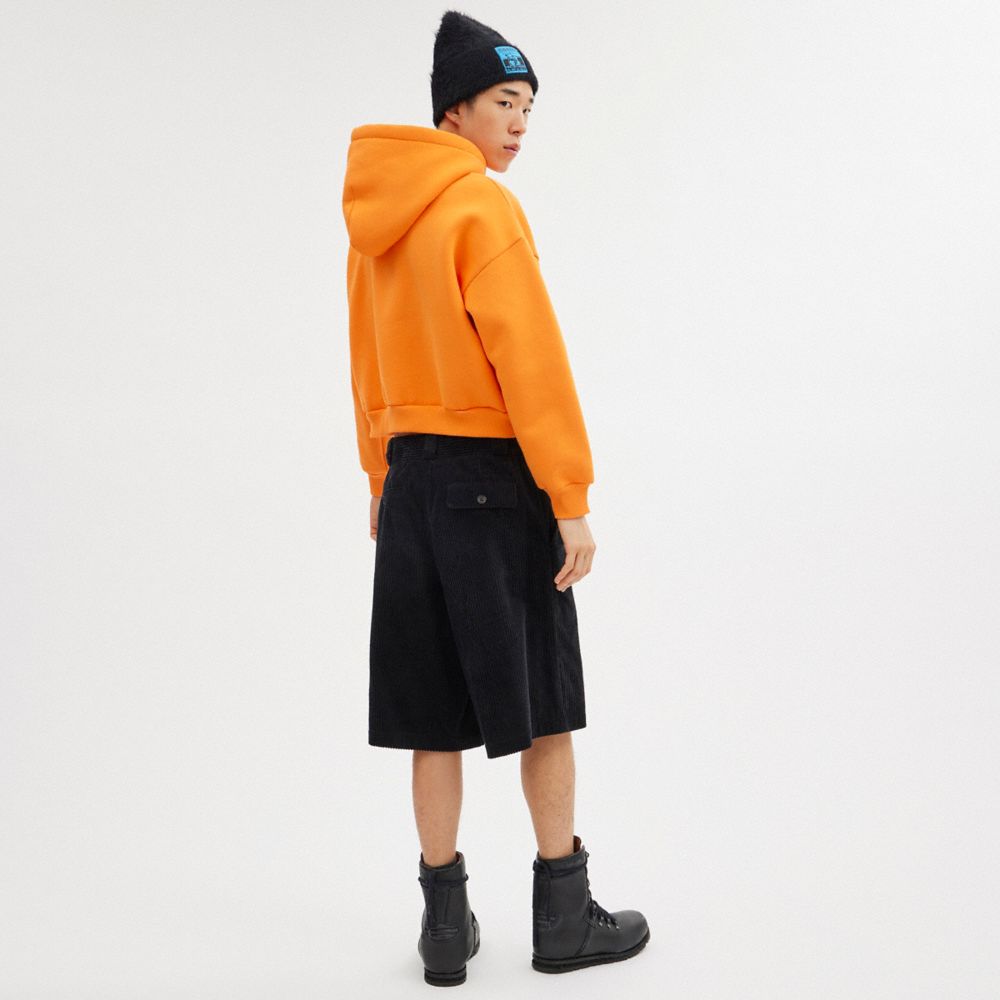 COACH®,The Lil Nas X Drop Cropped Pullover Hoodie,Polyester,Elastane,Cotton,Knit,Sweatshirt,Word Embellishment,Drawstring,...,Orange,Scale View