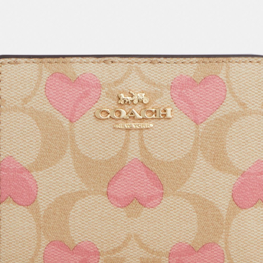 COACH®,SNAP WALLET IN SIGNATURE CANVAS WITH HEART PRINT,Signature Canvas,Mini,Gold/Light Khaki Chalk Multi