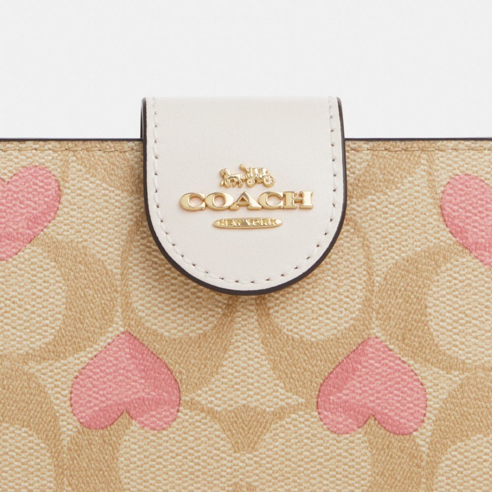 COACH®,MEDIUM CORNER ZIP WALLET IN SIGNATURE CANVAS WITH HEART PRINT,Signature Canvas,Mini,Gold/Light Khaki Chalk Multi