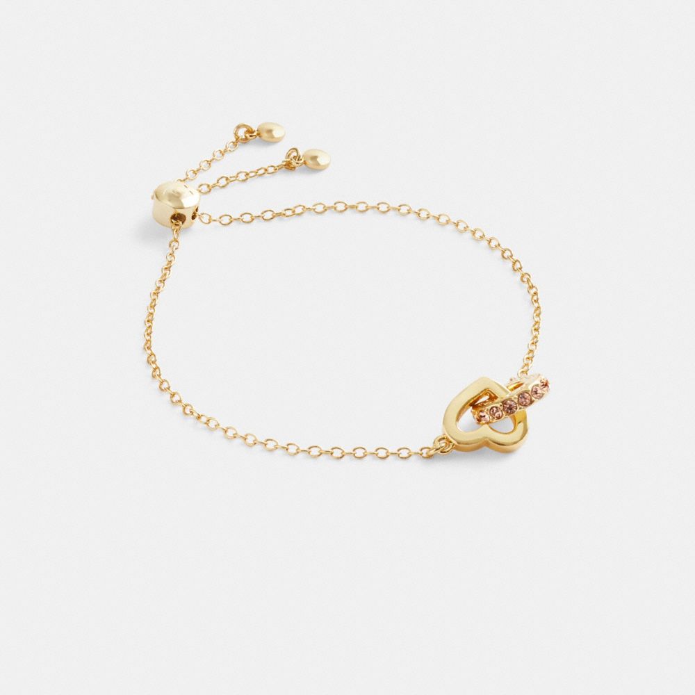 COACH®,INTERLOCKING OPEN CIRCLE HEART SLIDER BRACELET,Gold,Front View