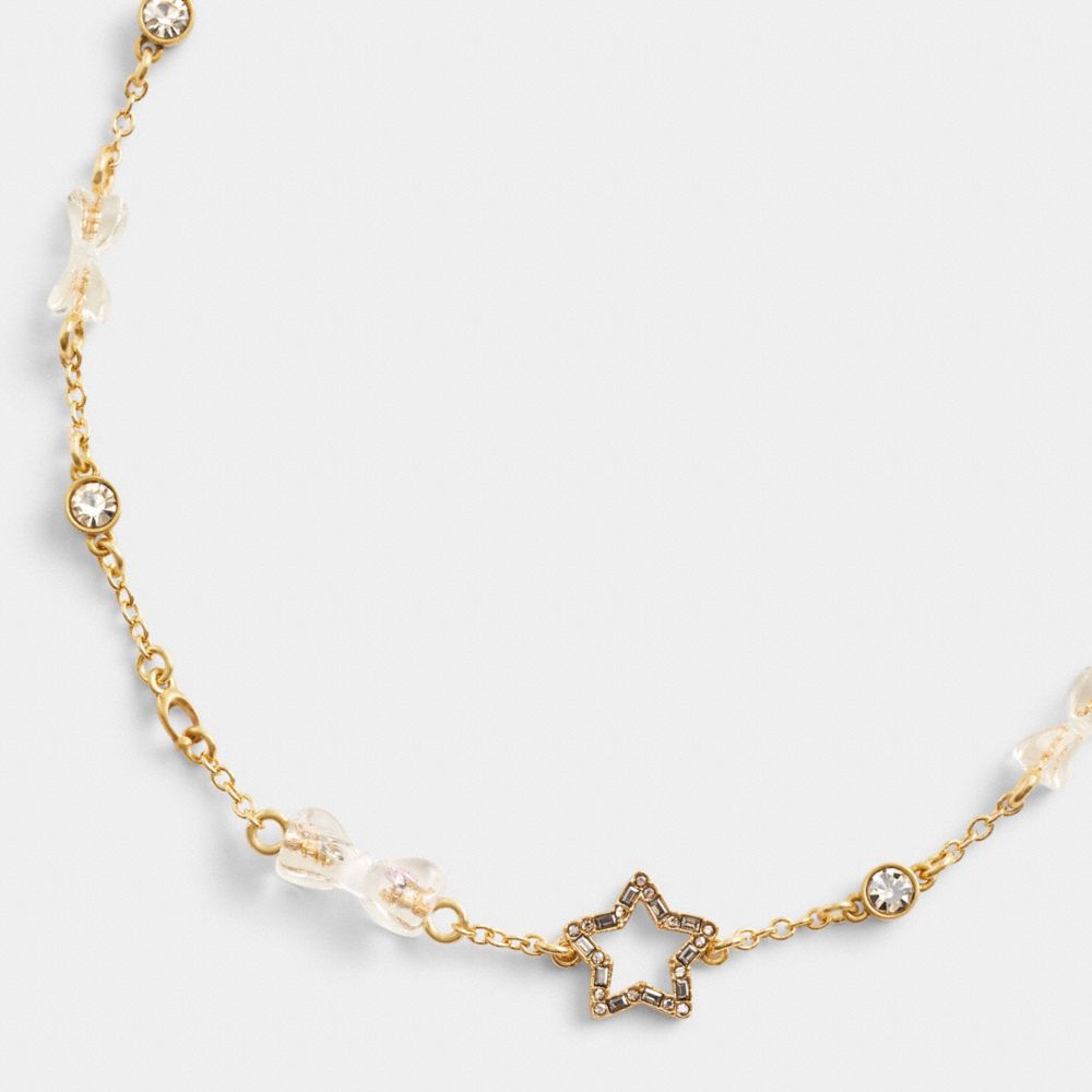 COACH®,STARS AND BOWS CHOKER NECKLACE,Gold/Clear,Front View