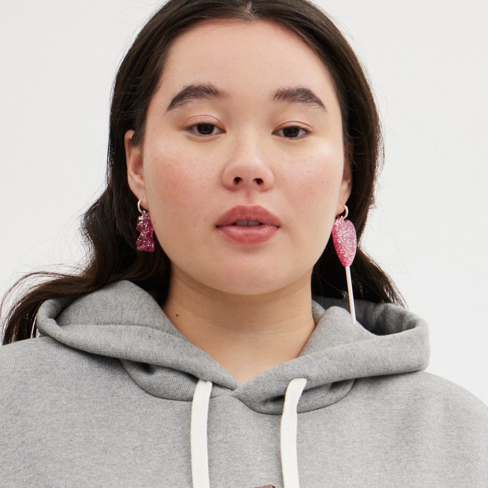 COACH®,The Lil Nas X Drop Cat And Heart Lollipop Mismatch Earrings,Hoops,Dangle Earring,Resin,Glass,Glitter,Novelty Embell...,Pink,Metallic,Detail View