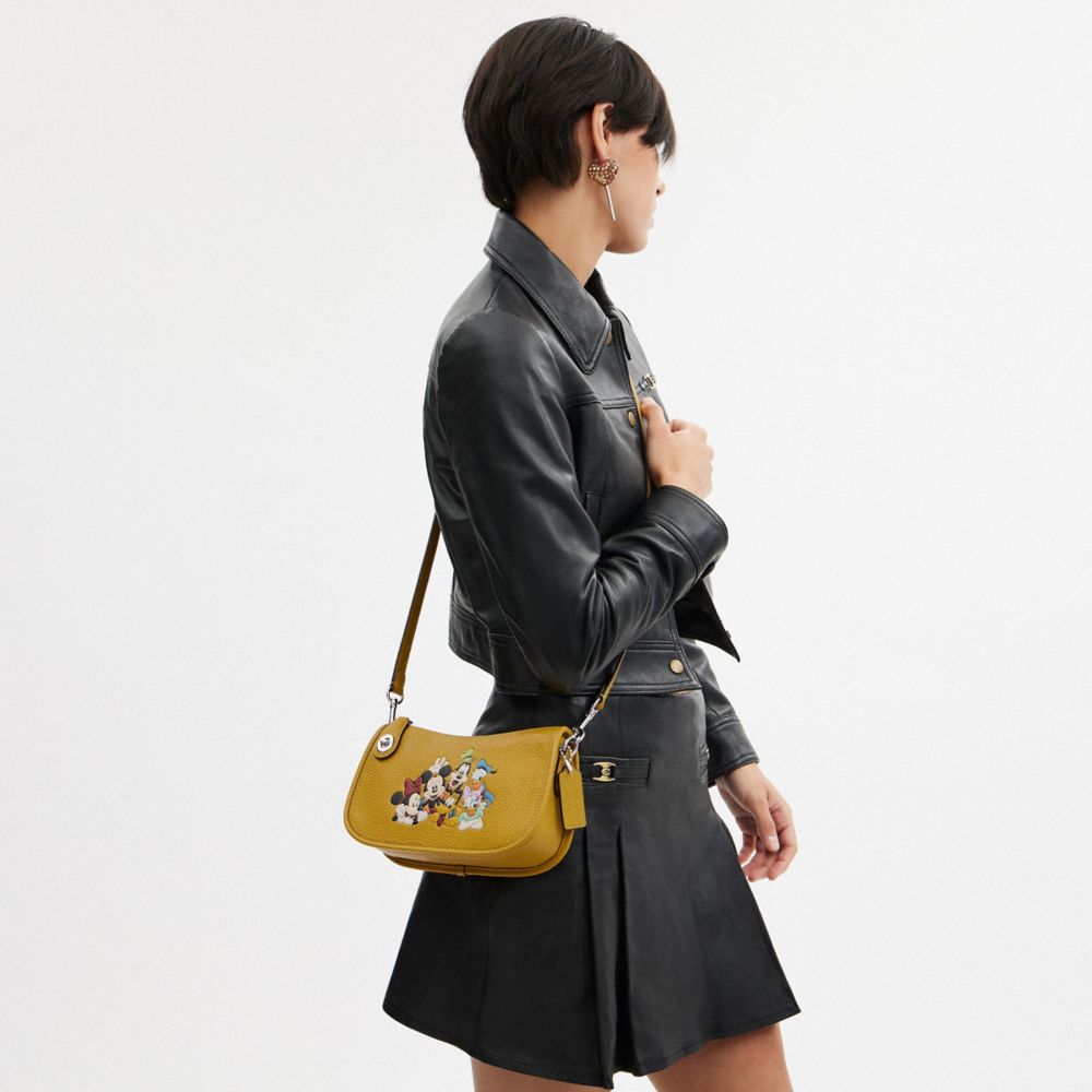 Coach Disney X  Swinger Bag In Regenerative Leather With Mickey Mouse And Friends In Silver/flax Multi