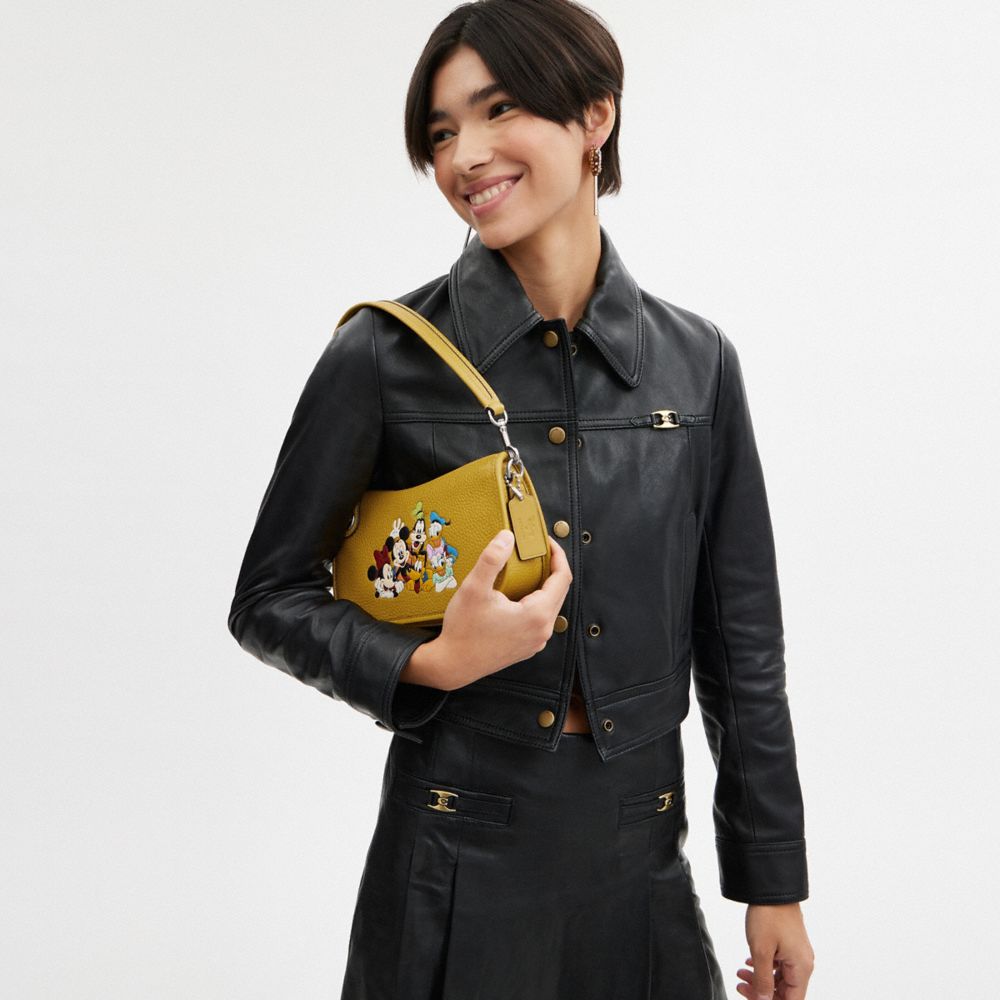 Coach Disney X  Swinger Bag In Regenerative Leather With Mickey Mouse And Friends In Silver/flax Multi