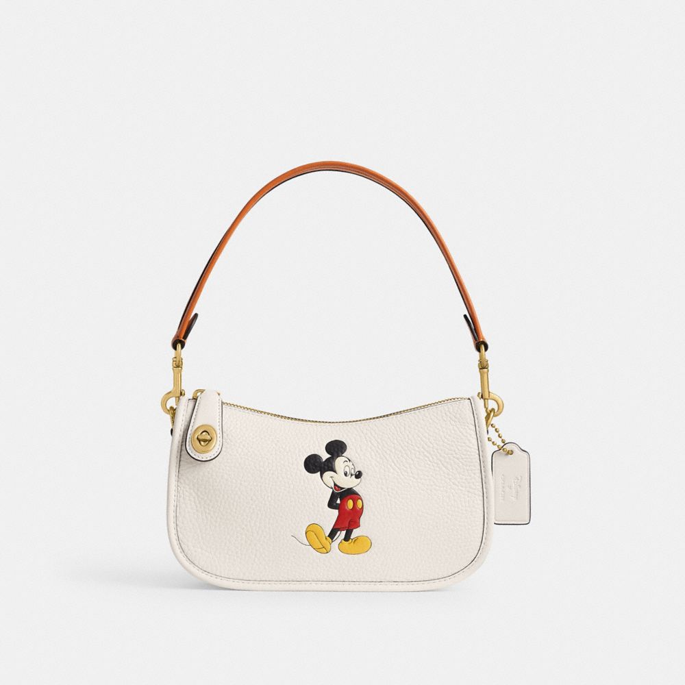 Coach Disney X  Swinger Bag In Regenerative Leather With Mickey Mouse In Brass/chalk Multi
