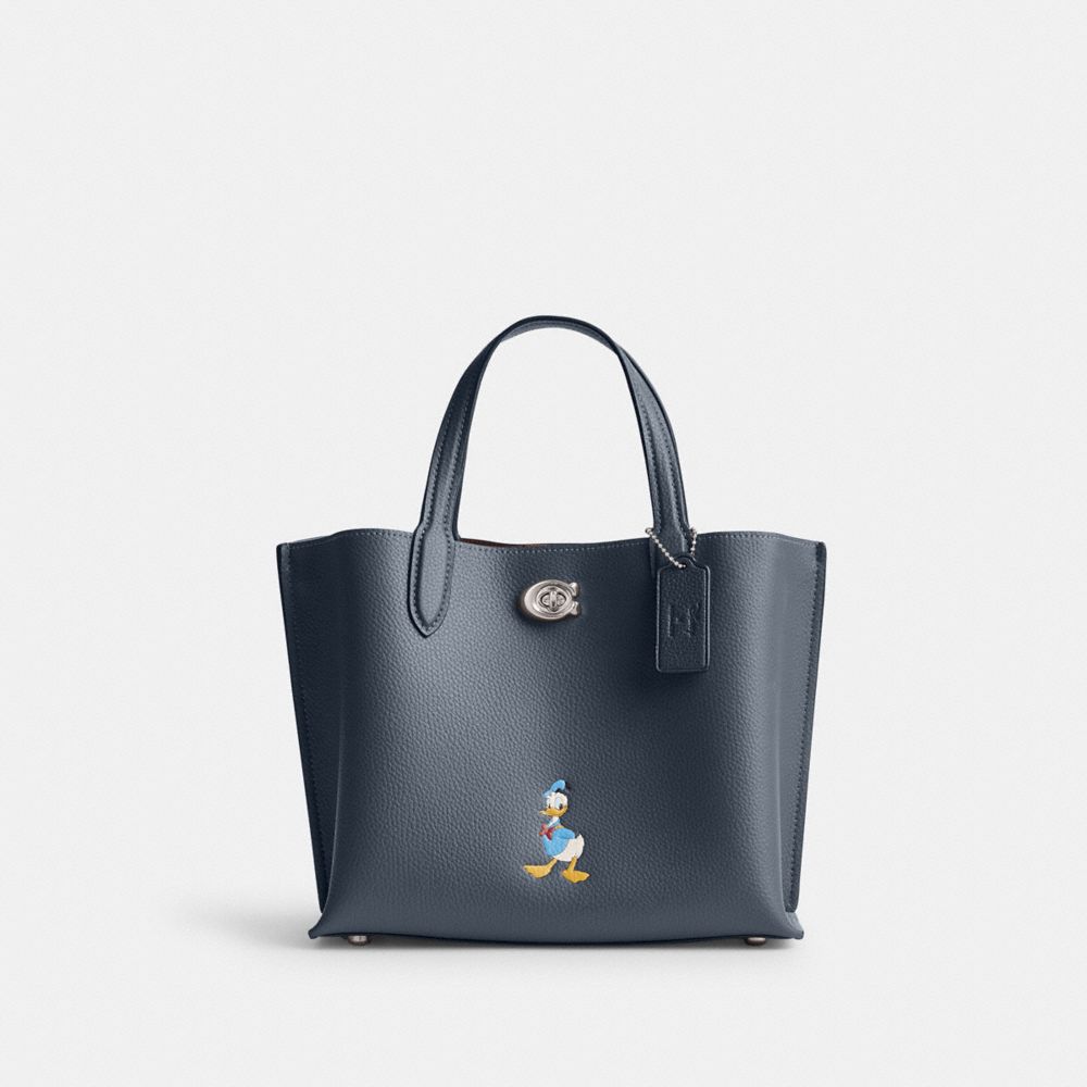 COACH®,Disney X Coach Willow Tote Bag 24 With Donald Duck,Leather,Crossbody,Graphic,Embossed,Logo,Color Metal,Casual,Work,Navy,Front View