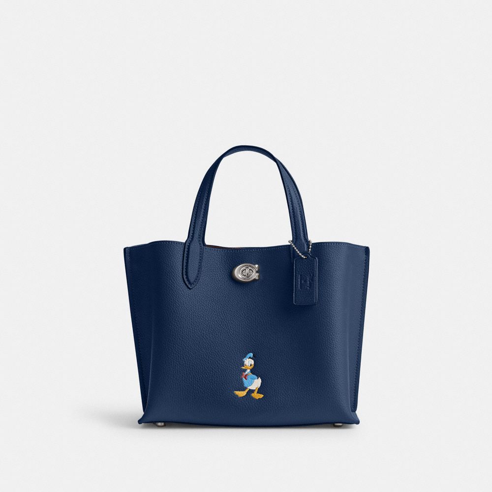 COACH®,Disney X Coach Willow Tote Bag 24 With Donald Duck,Leather,Crossbody,Graphic,Embossed,Logo,Color Metal,Casual,Work,Navy,Front View