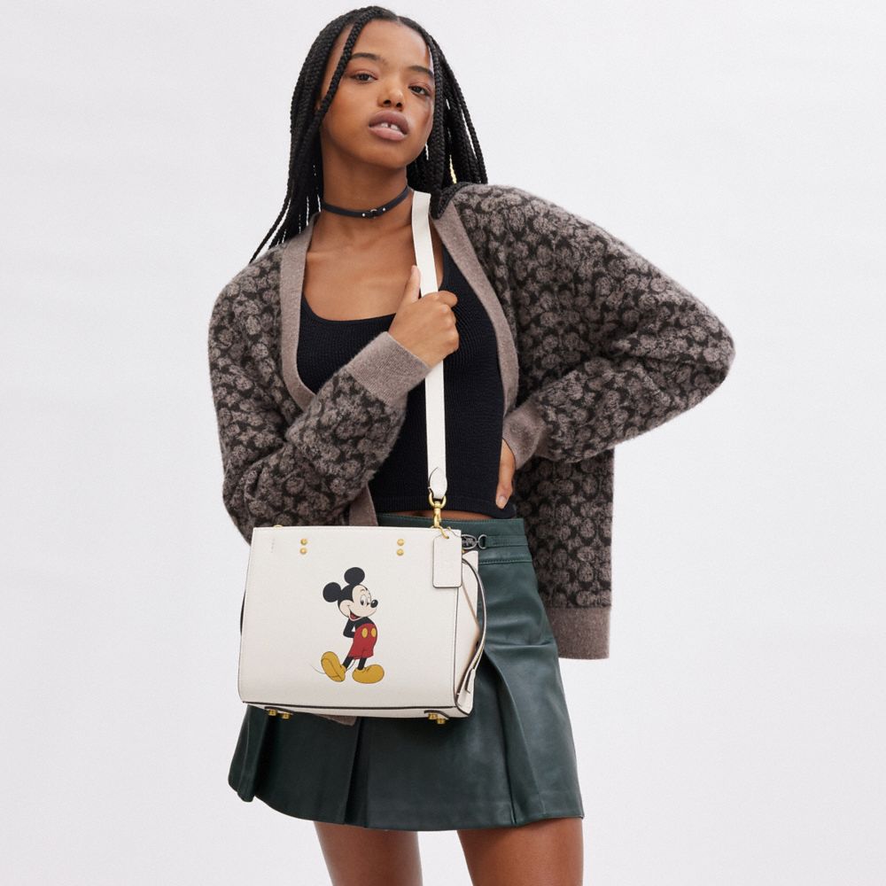 COACH®,Disney X Coach Rogue Bag 25 With Mickey Mouse,Leather,Satchel,Studded,Logo,Adjustable,Brass,Day Party,White,Detail View
