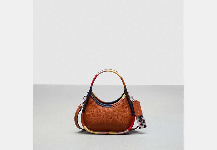 COACH®,Mini Ergo Bag with Crossbody Strap in Coachtopia Leather with Upcrafted Scrap Binding,Coachtopia Leather,...,Burnished Amber Multi,Front View image number 0