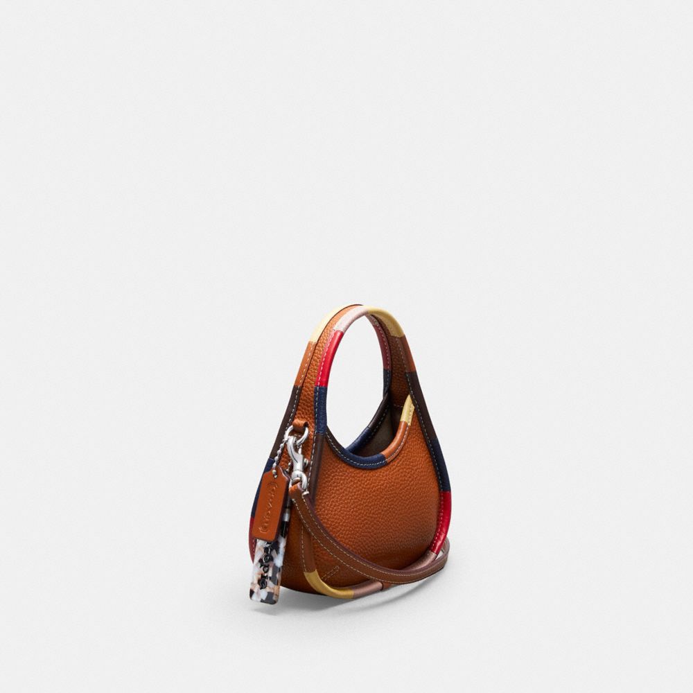 COACH®,Mini Ergo Bag With Crossbody Strap In Coachtopia Leather with Upcrafted Leather Binding,Coachtopia Leathe...,Burnished Amber Multi,Angle View