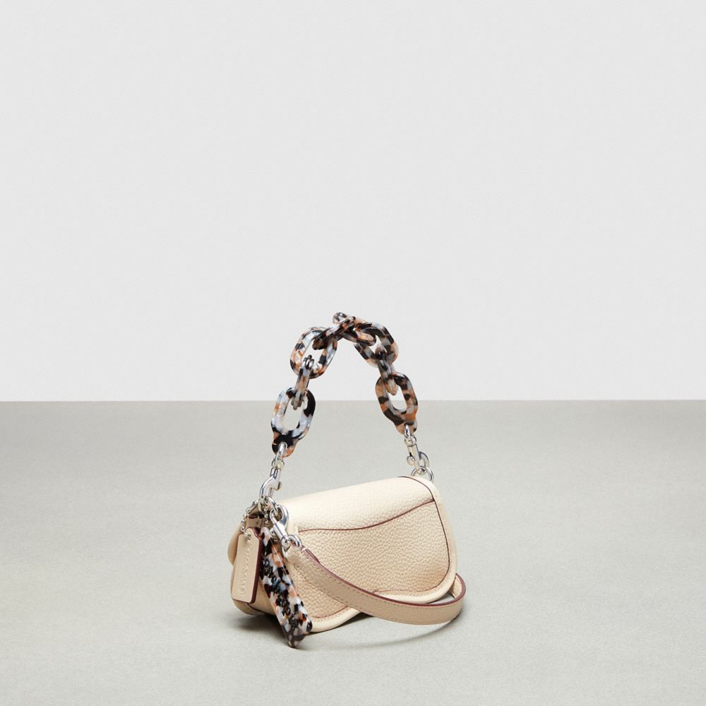COACH®,Mini Wavy Dinky Bag With Crossbody Strap In Coachtopia Leather,Coachtopia Leather,Mini,Cloud,Angle View