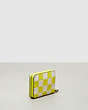 COACH®,Zip Around Wallet in Checkerboard Upcrafted Leather,Mini,Checkerboard,Bright Yellow/Chalk,Angle View