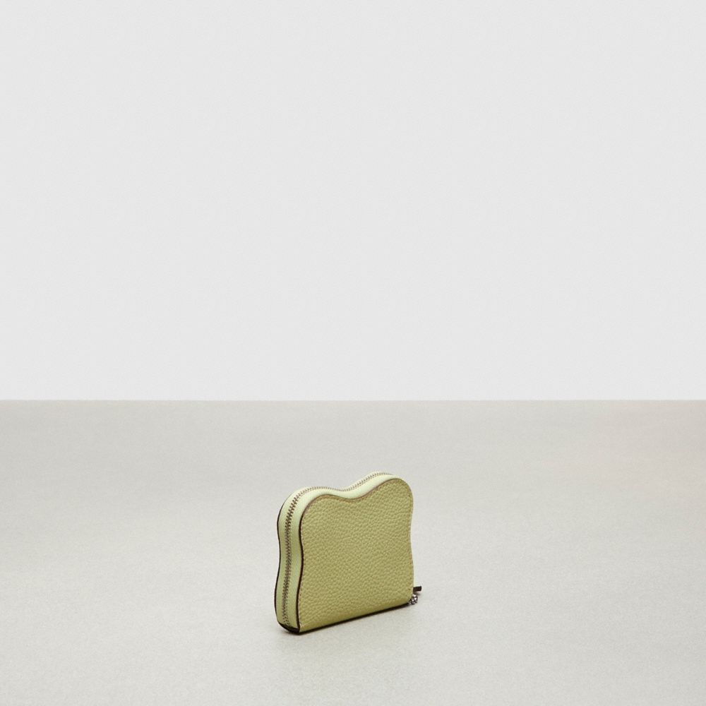 COACH®,Wavy Zip Around Wallet In Coachtopia Leather,Mini,Pale Lime,Angle View