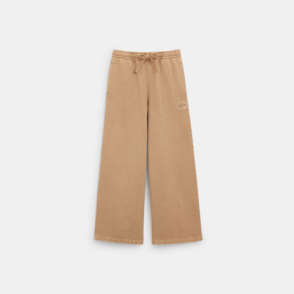 Shop Coach Outlet Garment Dye Track Pants In Pale Khaki
