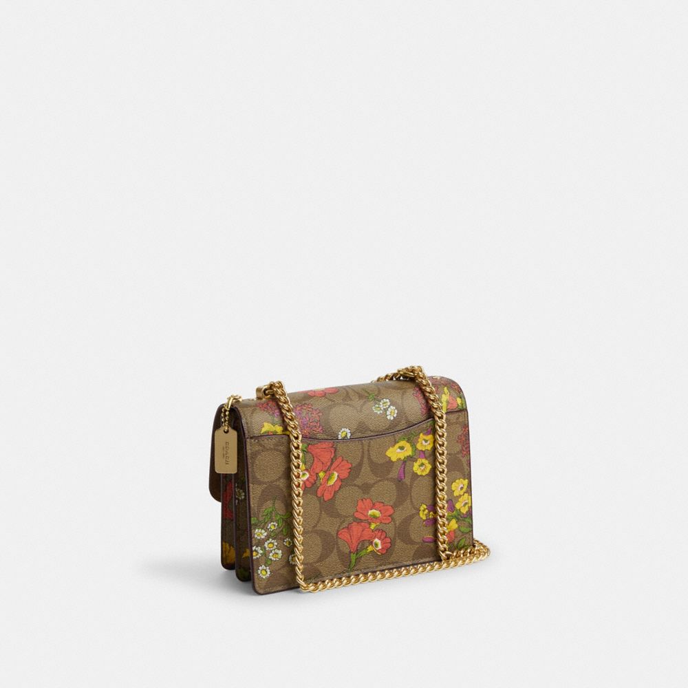 COACH®,MINI KLARE CROSSBODY IN SIGNATURE CANVAS WITH FLORAL PRINT,Signature Canvas,Mini,Gold/Khaki Multi,Angle View