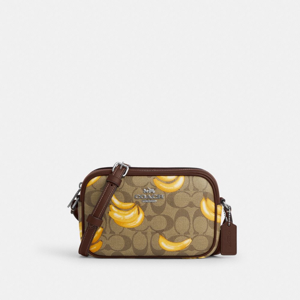 COACH®,MINI JAMIE CAMERA BAG IN SIGNATURE CANVAS WITH BANANA PRINT,Signature Canvas,Small,Silver/Khaki/Dark Saddle,Front View image number 0