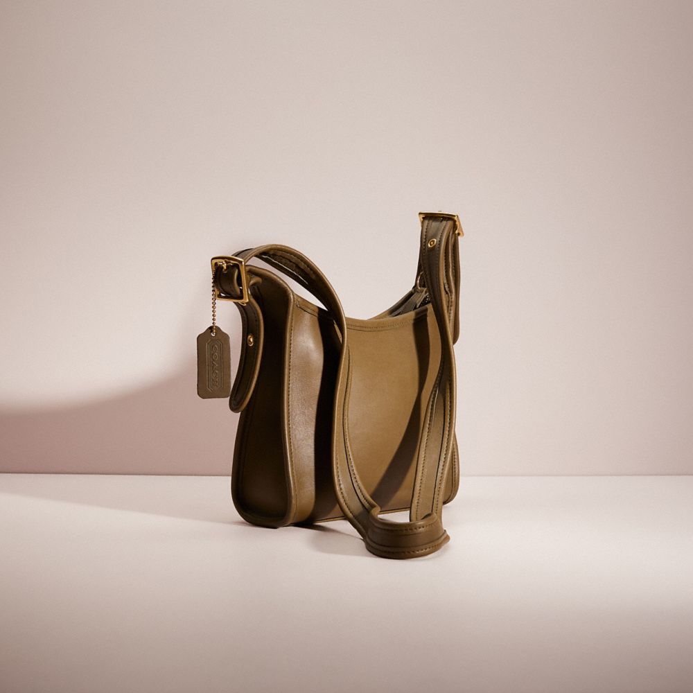 COACH®,Vintage Legacy Small Zip Bag,Leather,Hobo,Logo,Tag Embellishment,Casual,Brown,Angle View