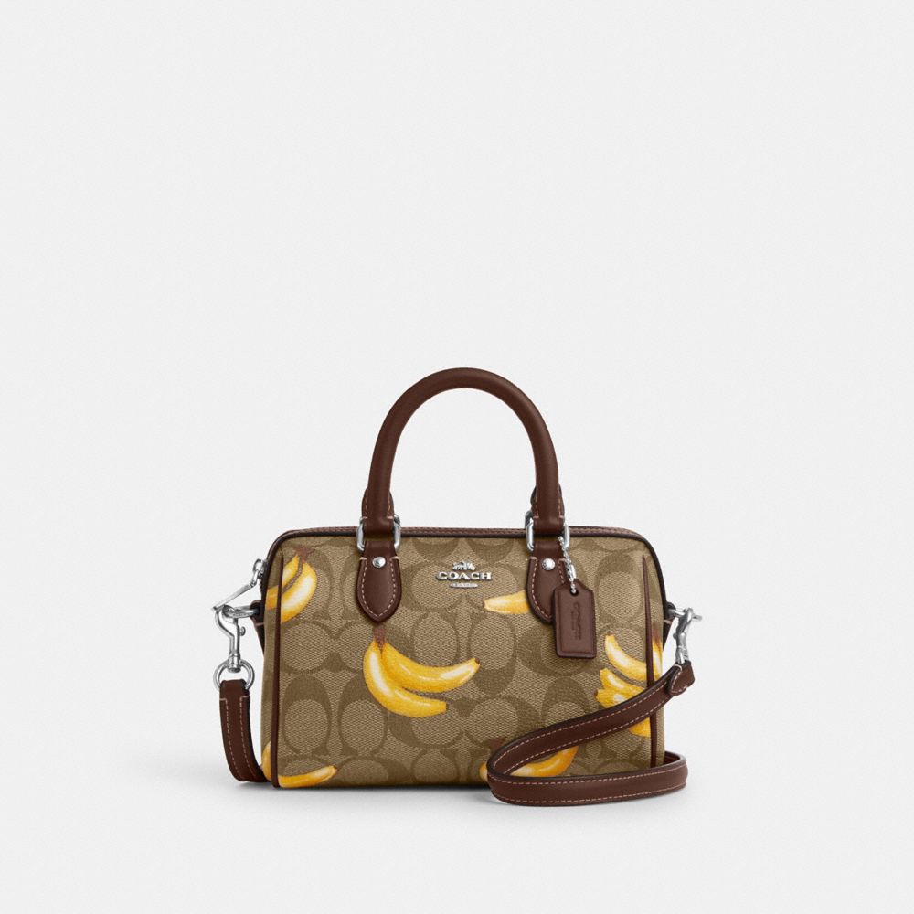 Shop Coach Outlet Mini Rowan Crossbody In Signature Canvas With Banana Print In Brown