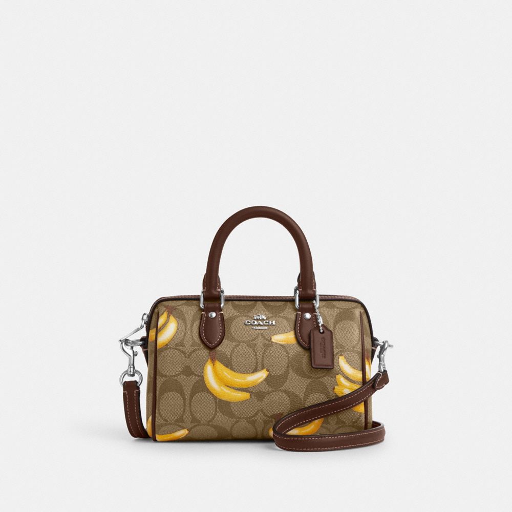 COACH®,MINI ROWAN CROSSBODY IN SIGNATURE CANVAS WITH BANANA PRINT,Signature Canvas,Small,Silver/Khaki/Dark Saddle,Front View