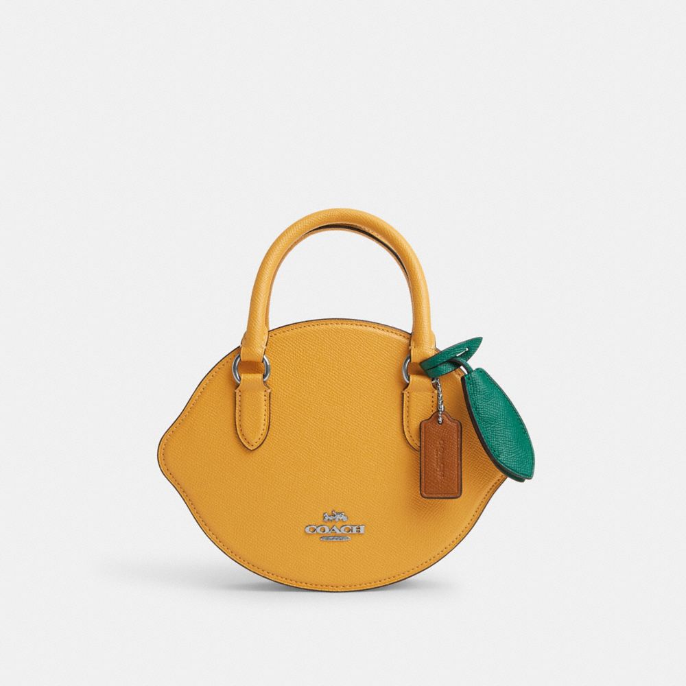 Shop Coach Outlet Lemon Crossbody In Yellow