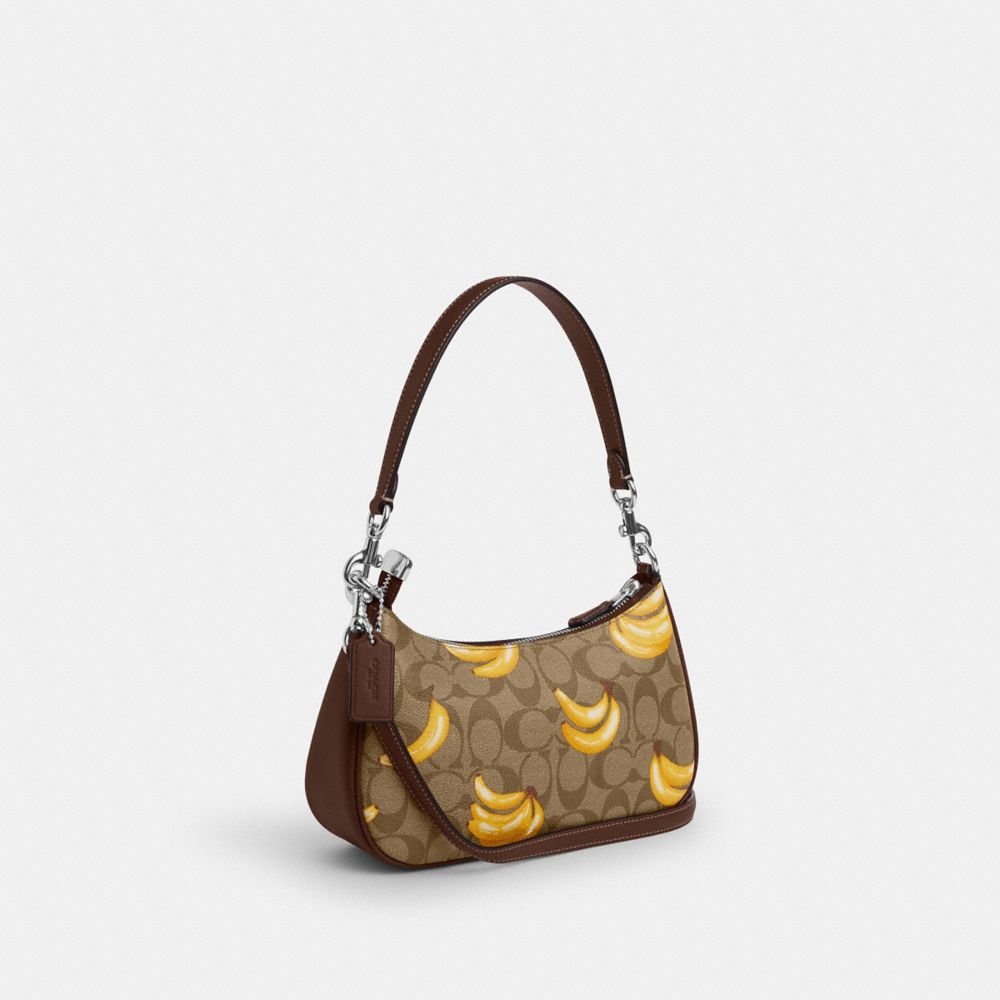 COACH®,TERI SHOULDER BAG IN SIGNATURE CANVAS WITH BANANA PRINT,Signature Canvas,Silver/Khaki/Dark Saddle,Angle View