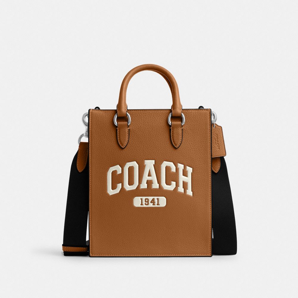 COACH®,DYLAN TOTE BAG WITH VARSITY,Novelty Leather,Medium,Silver/Light Saddle,Front View