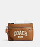 COACH®,CARRY ALL POUCH WITH VARSITY,Leather,Silver/Light Saddle,Front View