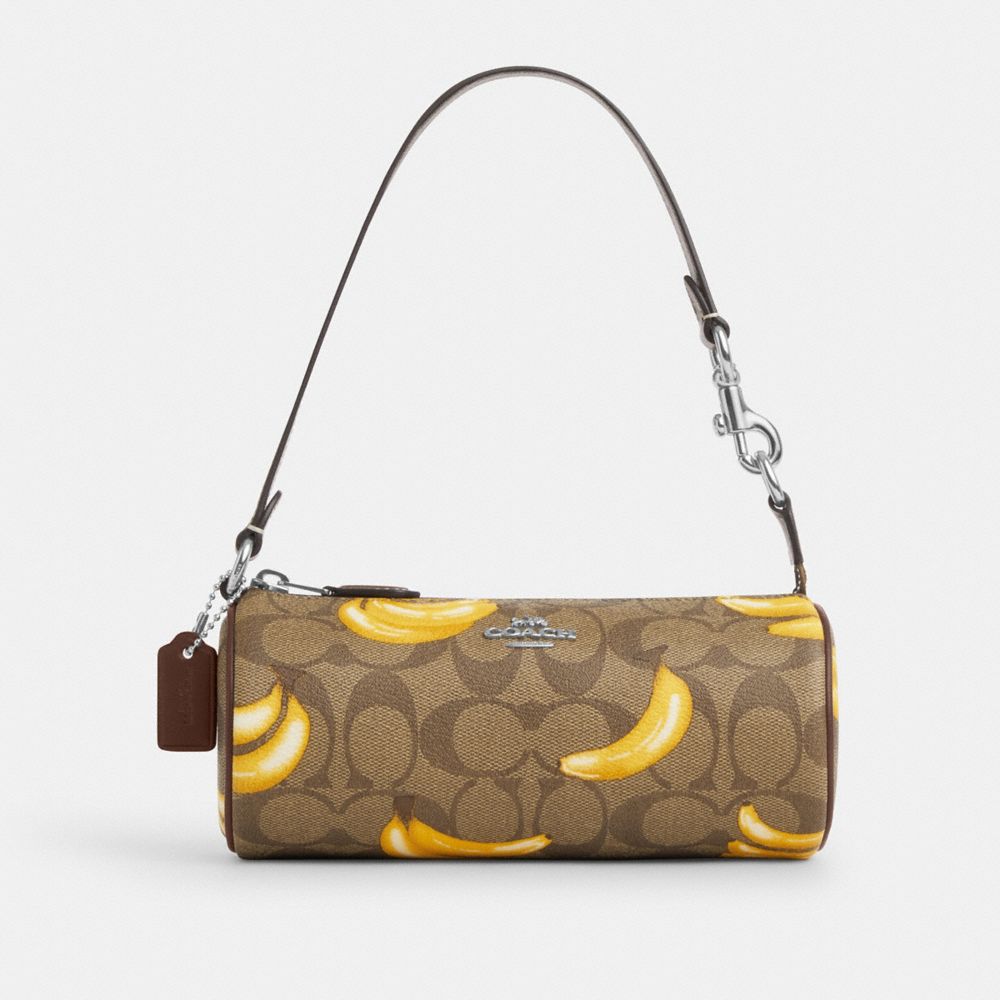 COACH®,NOLITA BARREL BAG IN SIGNATURE CANVAS WITH BANANA PRINT,pvc,Silver/Khaki/Dark Saddle,Front View