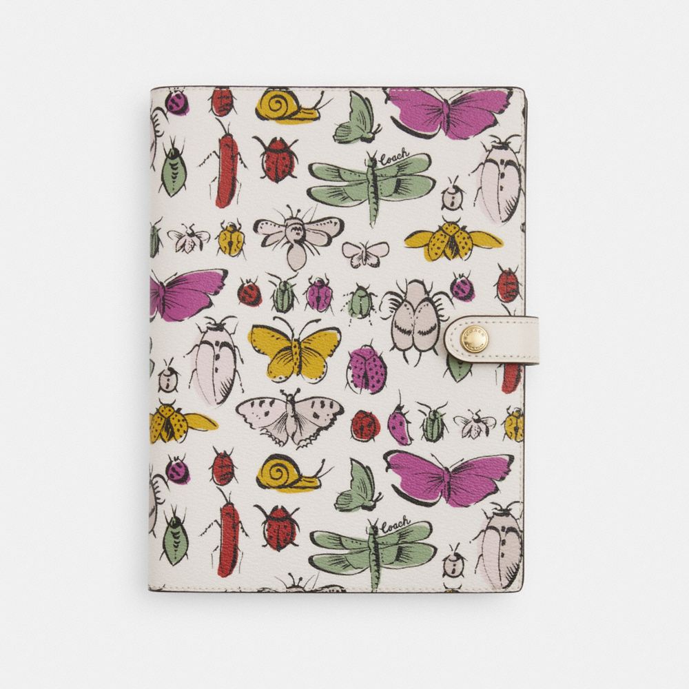 COACH®,NOTEBOOK WITH CREATURE PRINT,Gold/Chalk Multi,Front View