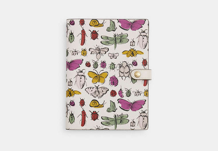 COACH®,NOTEBOOK WITH CREATURE PRINT,pvc,Gold/Chalk Multi,Front View