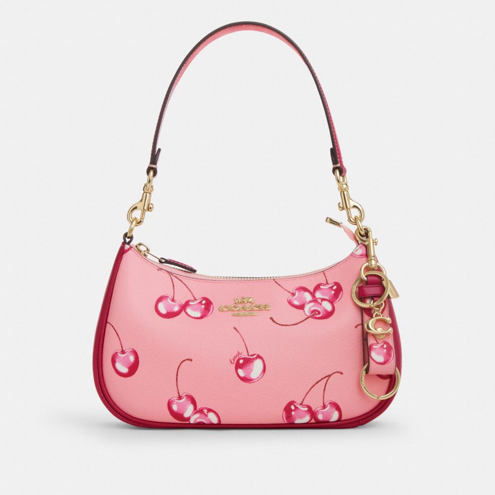 COACH®,TRIGGER SNAP BAG CHARM WITH CHERRY PRINT,Im/Flower Pink/Bright Violet,Angle View