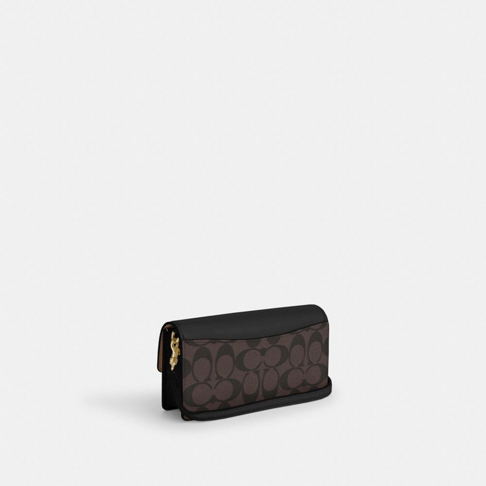 COACH®,Eliza Small Flap Crossbody In Signature Canvas,,Angle View