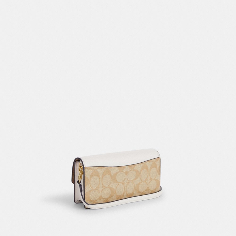 COACH®,Eliza Small Flap Crossbody In Signature Canvas,,Angle View