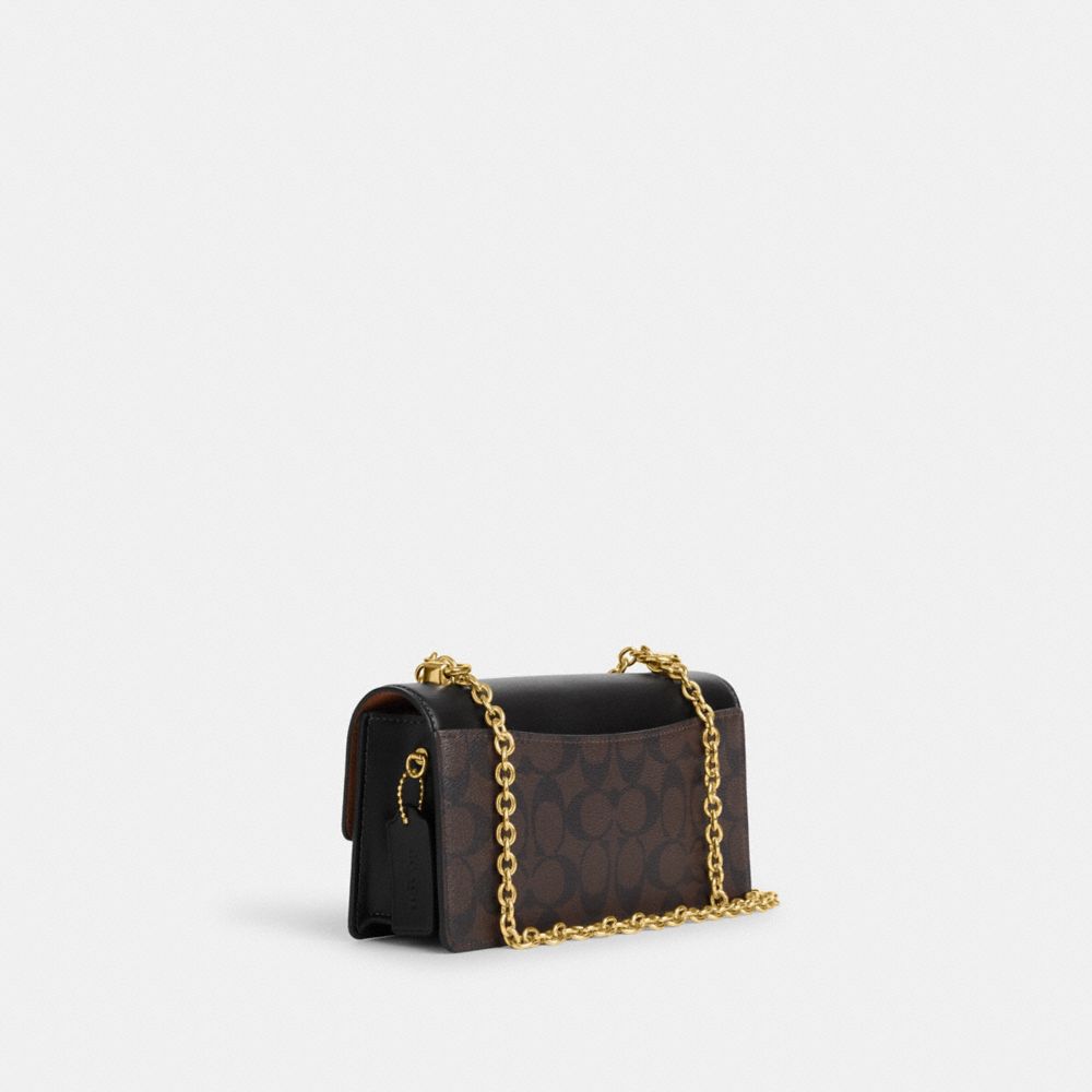 COACH®,Eliza Flap Crossbody Bag In Signature Canvas,,Angle View