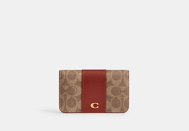 COACH®,ESSENTIAL SLIM CARD CASE IN SIGNATURE CANVAS,Coated Canvas,Mini,Brass/Tan/Rust,Front View image number 0