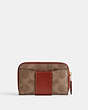 COACH®,ESSENTIAL SMALL ZIP AROUND CARD CASE IN SIGNATURE CANVAS,Coated Canvas,Mini,Brass/Tan/Rust,Back View