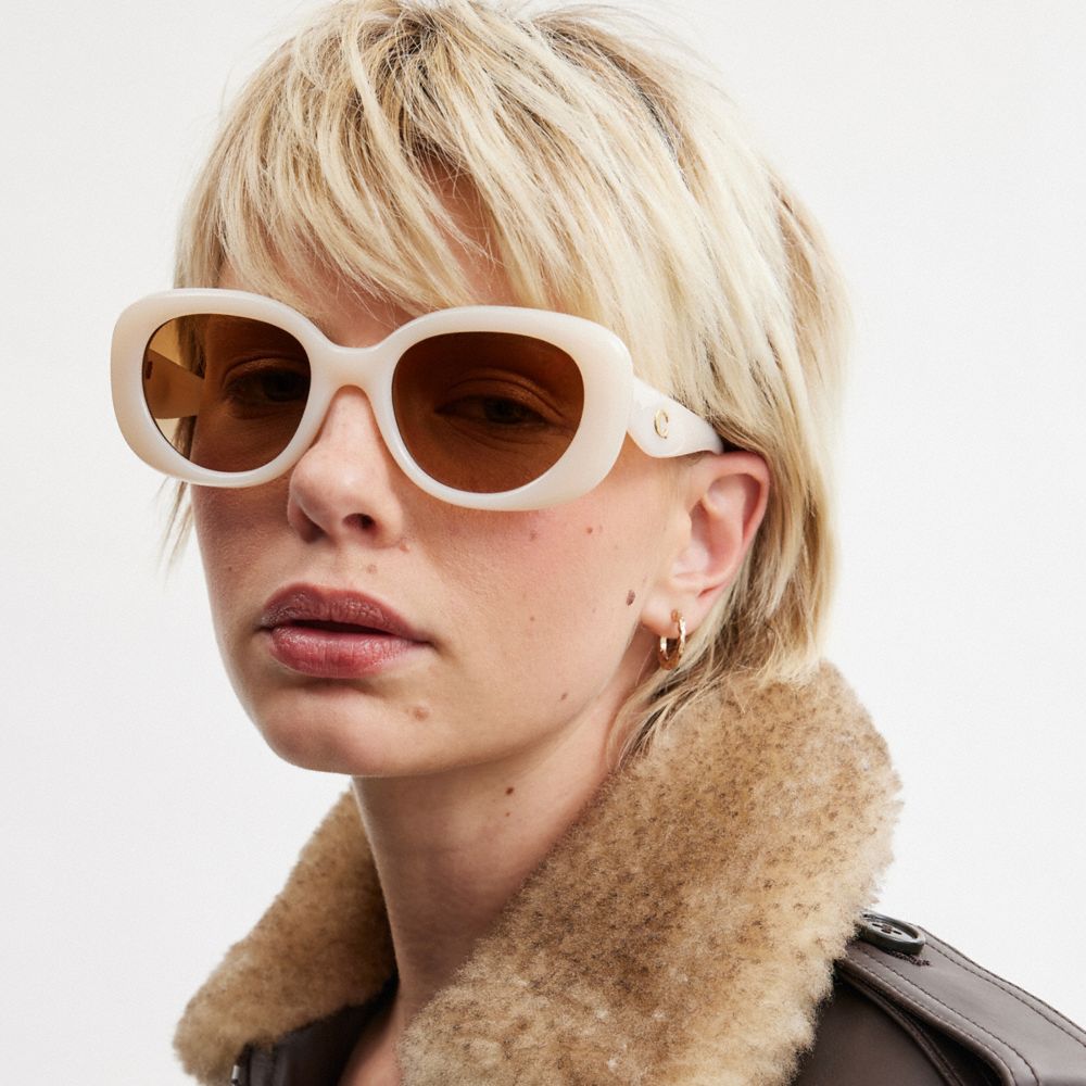 COACH®,PILLOW TABBY ROUND SUNGLASSES,Milky Ivory,Angle View