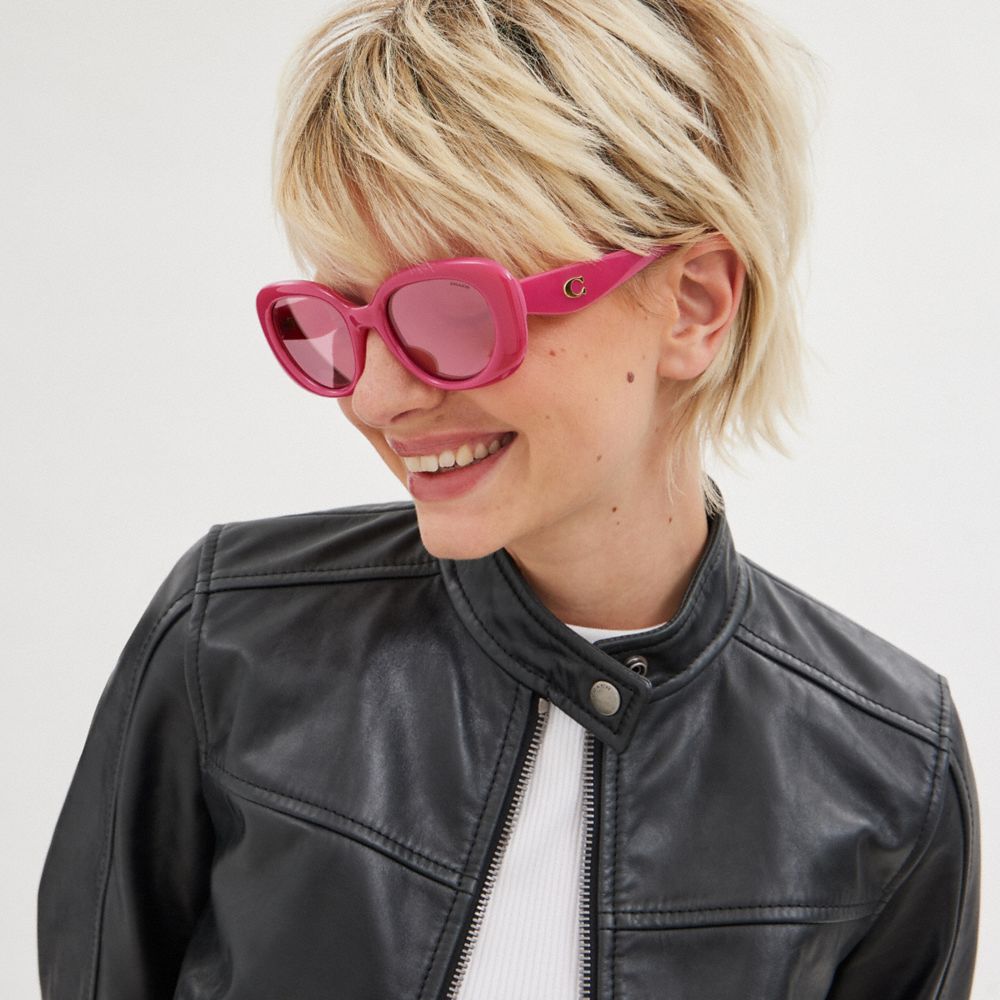 COACH®,PILLOW TABBY ROUND SUNGLASSES,Magenta,Angle View
