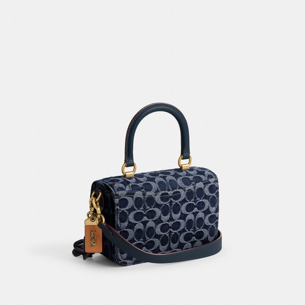 COACH®,ROGUE TOP HANDLE BAG IN SIGNATURE DENIM,Denim,Medium,Brass/Blue,Angle View