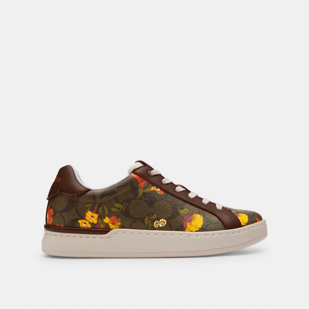 COACH®,CLIP LOW TOP SNEAKER IN SIGNATURE CANVAS WITH FLORAL PRINT,Dark Saddle,Angle View