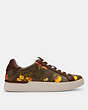 COACH®,CLIP LOW TOP SNEAKER IN SIGNATURE CANVAS WITH FLORAL PRINT,mixedmaterial,Dark Saddle,Angle View